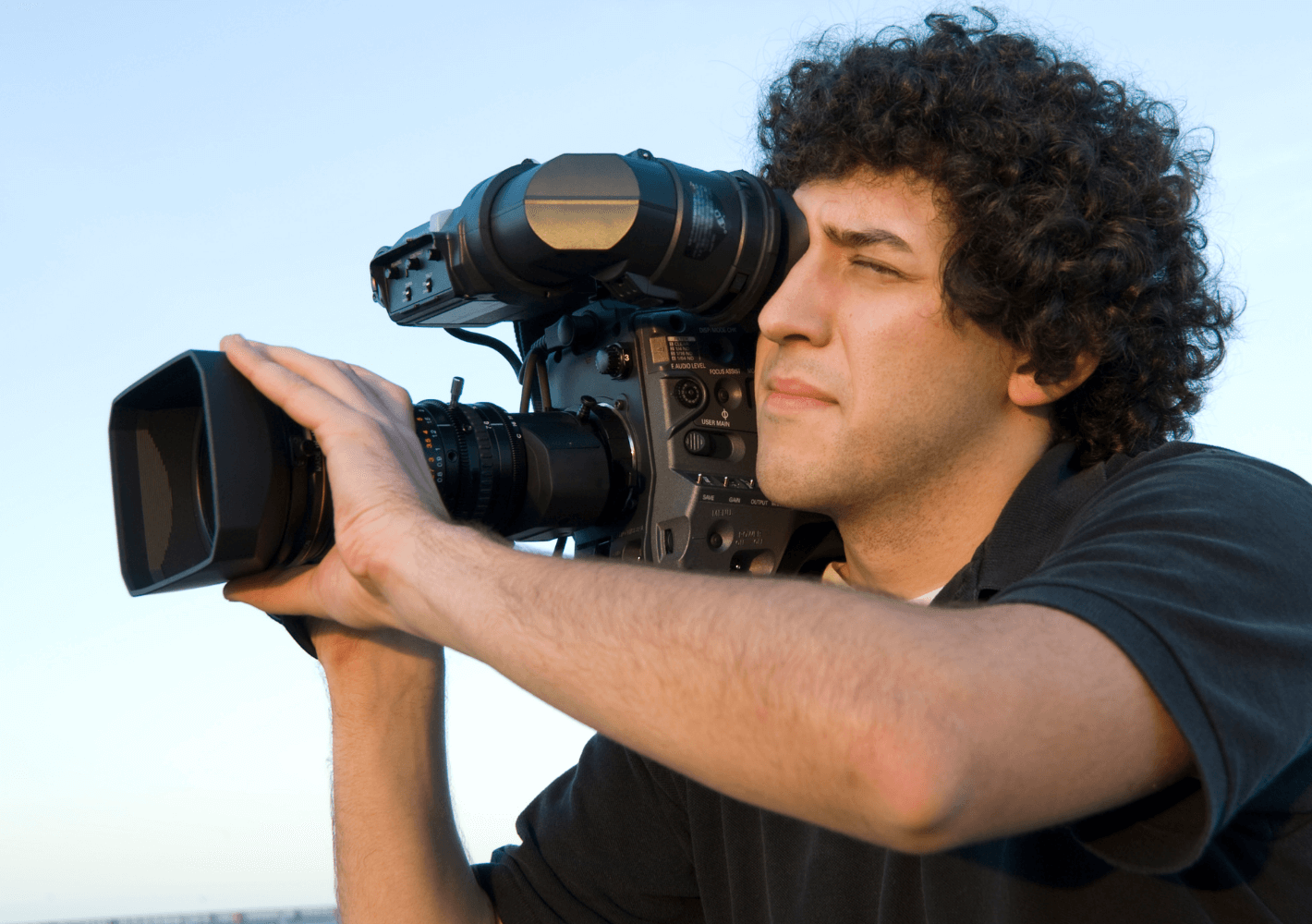 Man with Video Camera shooting GrooveVideo